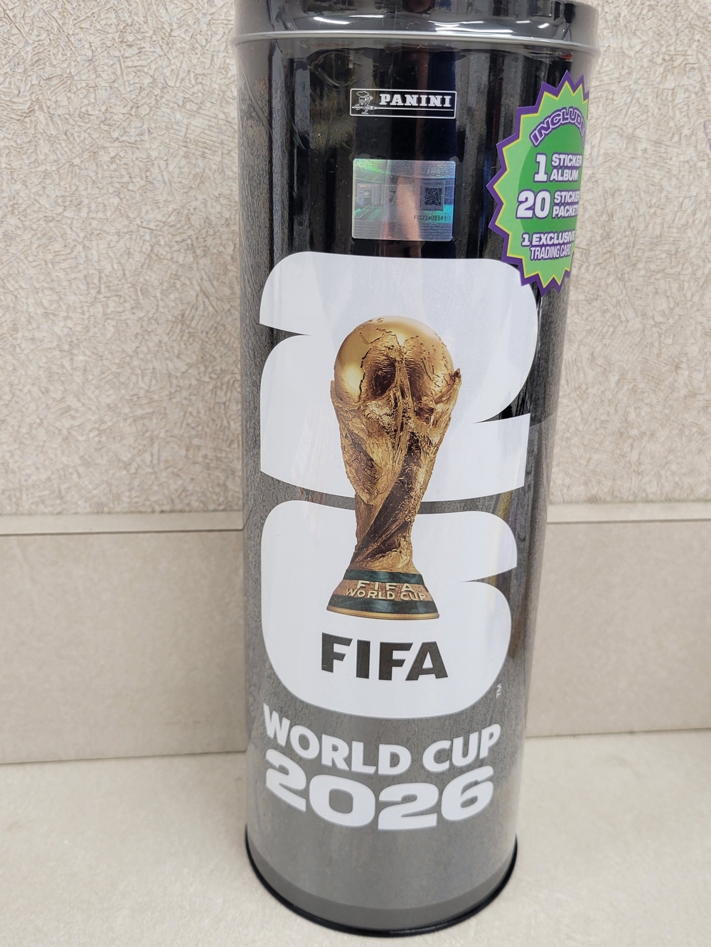 Panini FIFA World Cup 2026 Starter Tin with Gold Trophy Graphic.